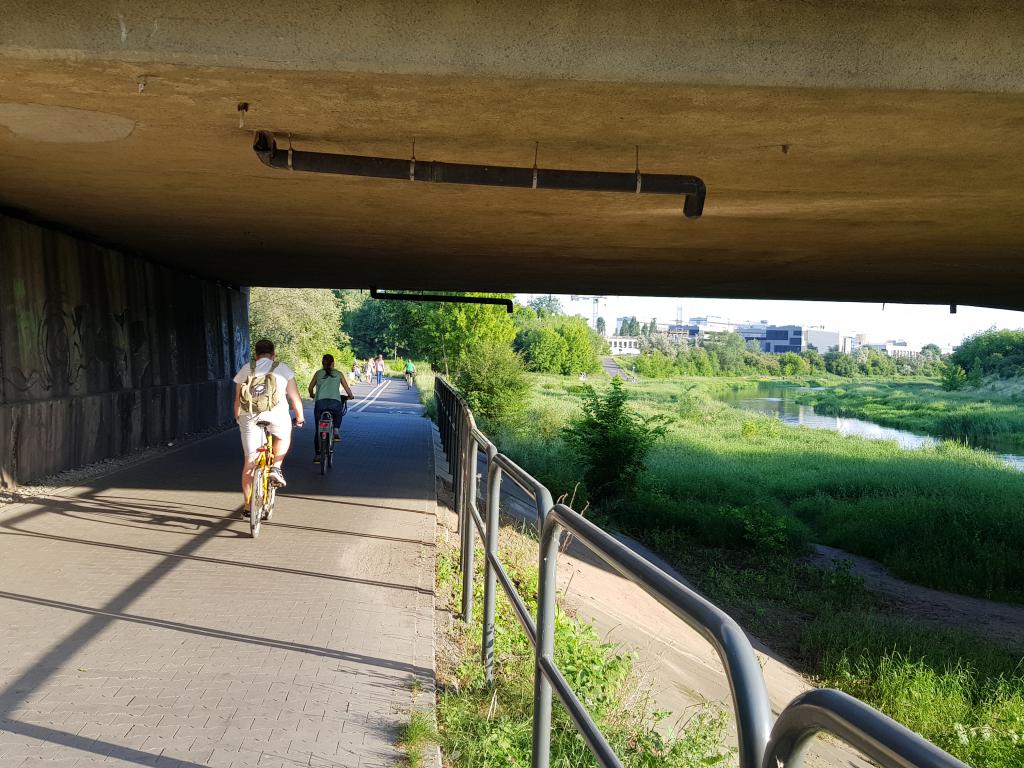 People cycling along Warta River, Poznan