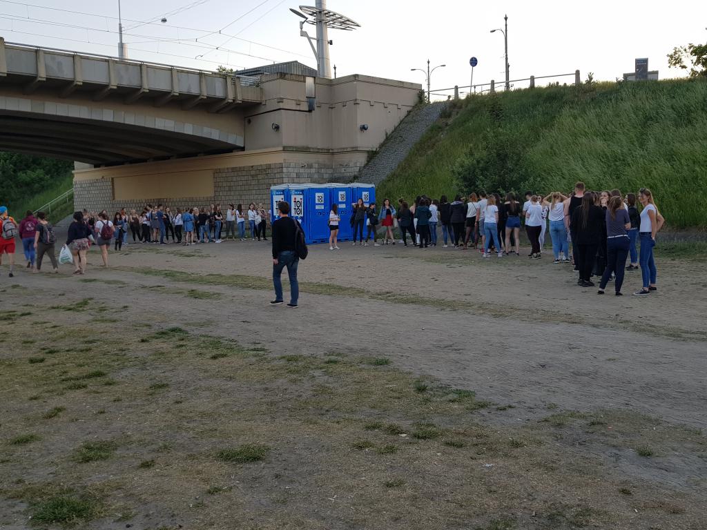 Young people at the gathering at the Warta River, Poznan. Portaloos provided