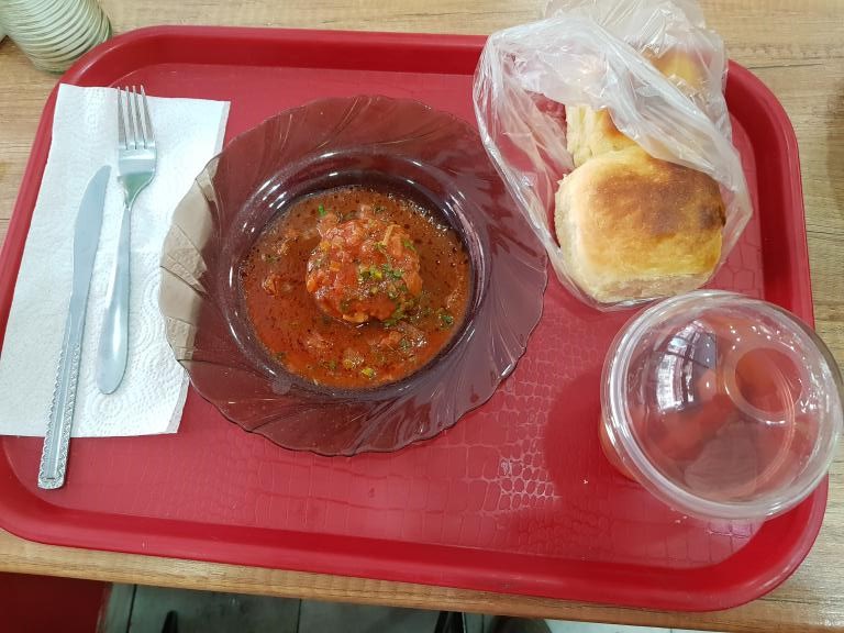 Georgian breakfast of pork cake, bun and 'fresh fruit juice'