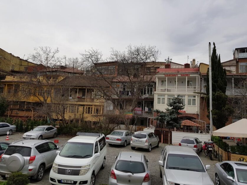 Old houses with wooden balcony facade