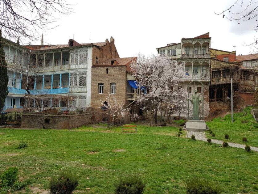 Old houses with wooden balcony facade