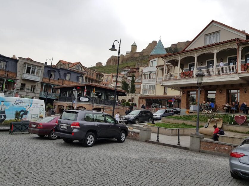 Old houses with wooden balcony facade