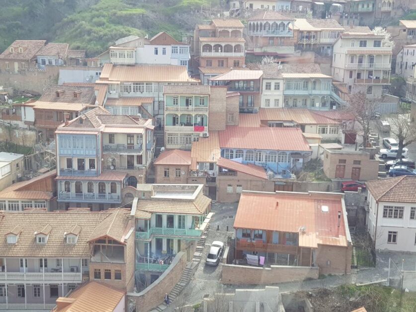 Old houses with wooden balcony facade