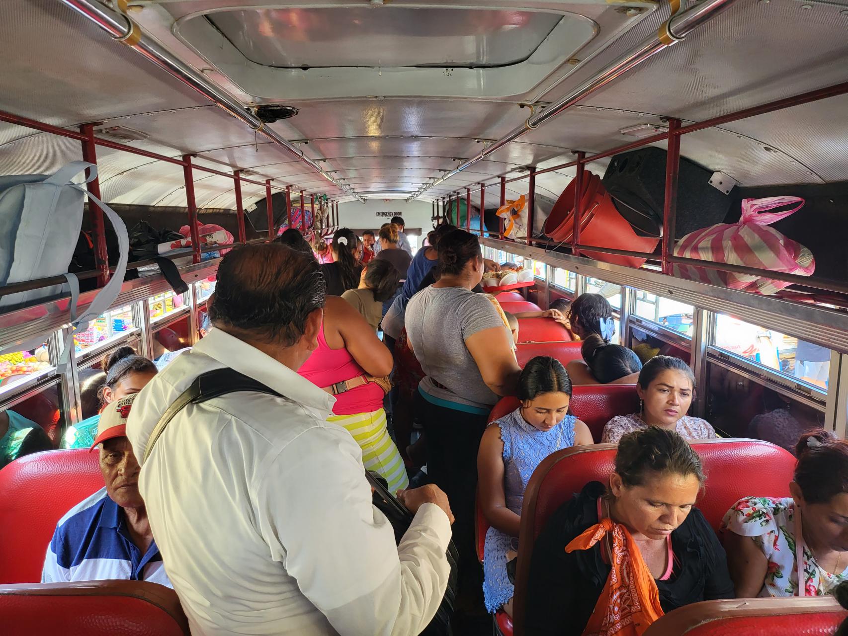 Traveling in local bus running between towns with only standing room