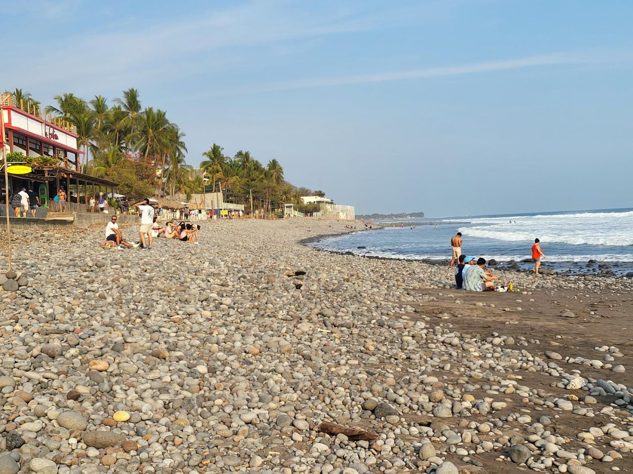 The pebbles and black sand of El Tunco Beach