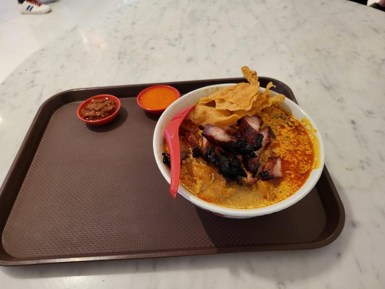 Back to Malaysia, a bowl of curry laksa (Malaysian spicy curry noodle) with chicken and barbecue pork 