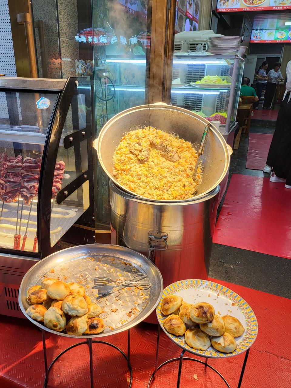 Signature Uyghur dishes - lamb pilaf and baked dumpling