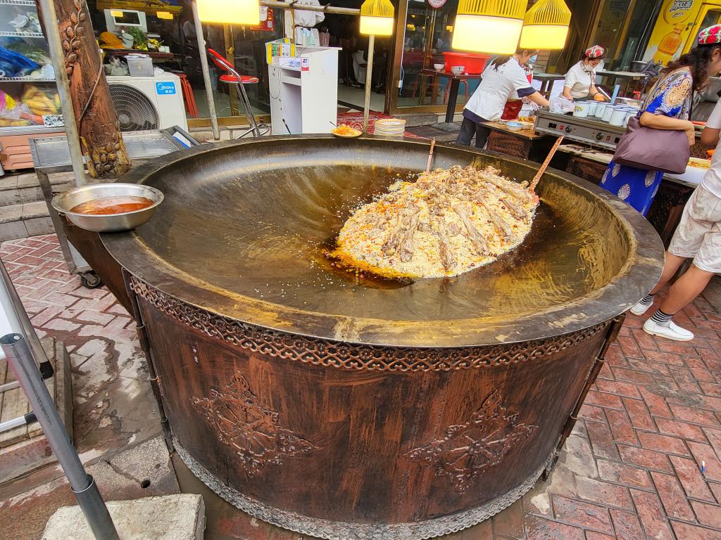 Mutton pilaf in a huge wok