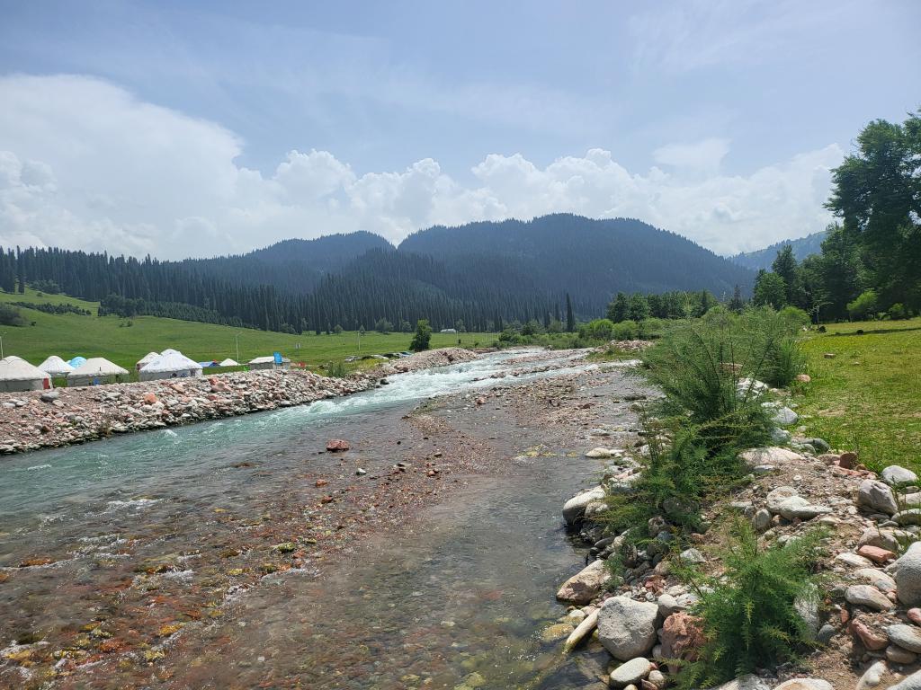 Campsite by a mountain stream in Kuerdening