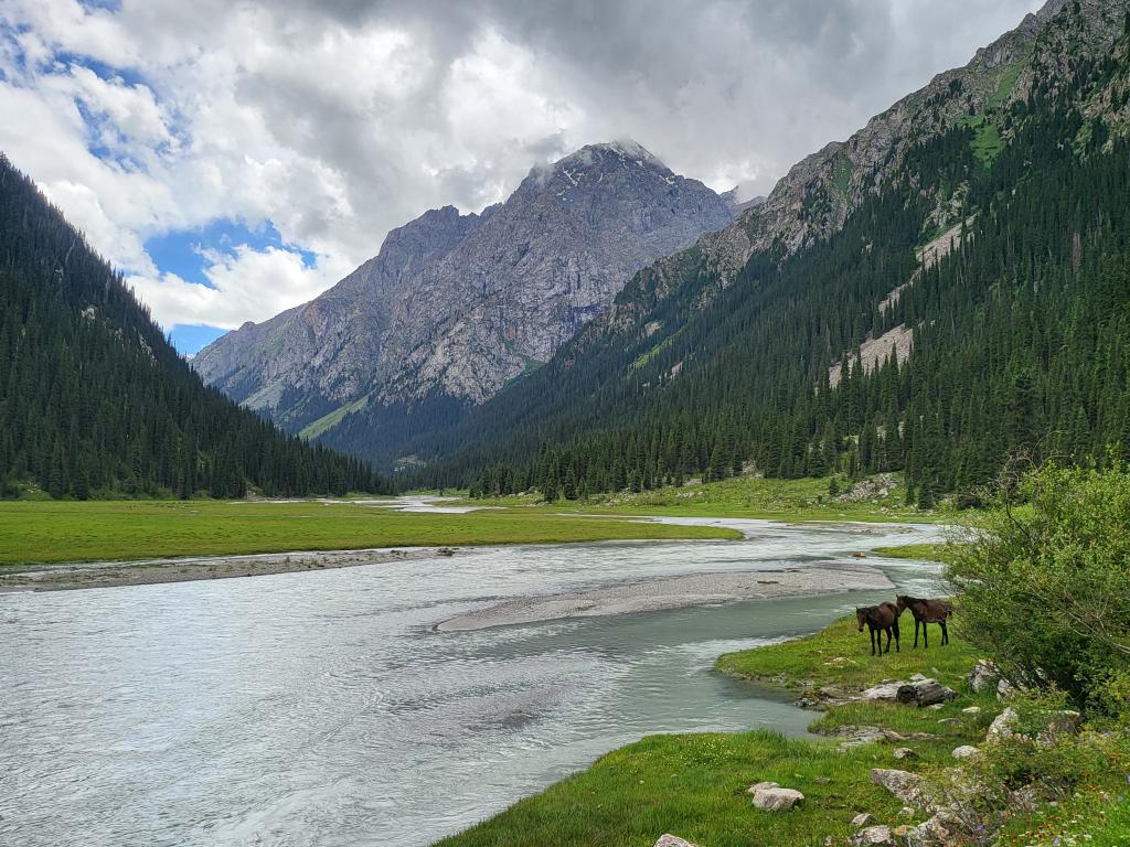 The river meandered through the valleys in Karakol National Park