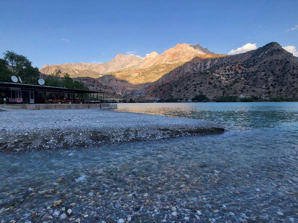 The color of the lake dimmed, the mountains glowed with the late afternoon sun