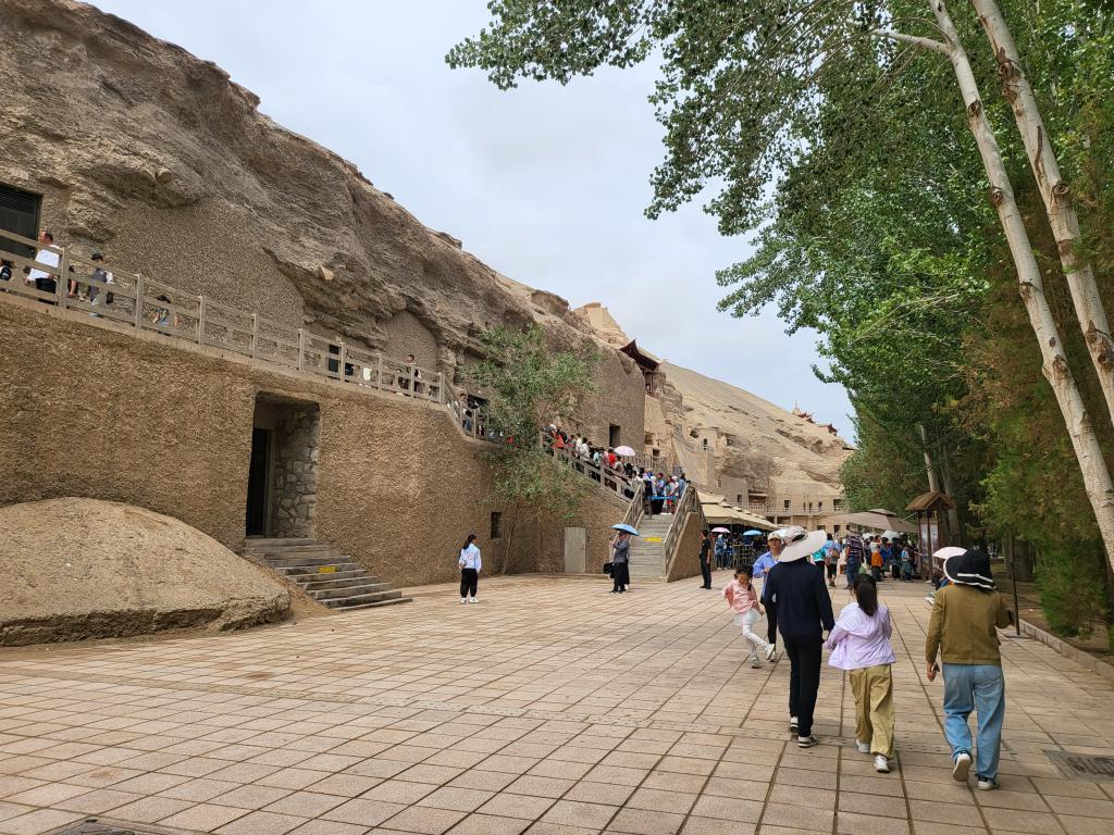 Caves of Mogao Grottoes carved into the cliff face 