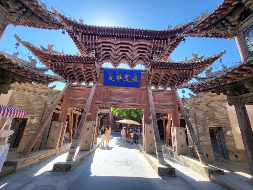 One of the wooden entrance gates in the Great Buddha Temple complex, anchored by wooden supports