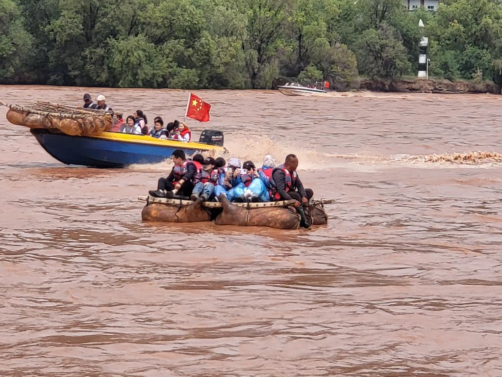 Tourists floating down Yellow River in a goat skin rafts