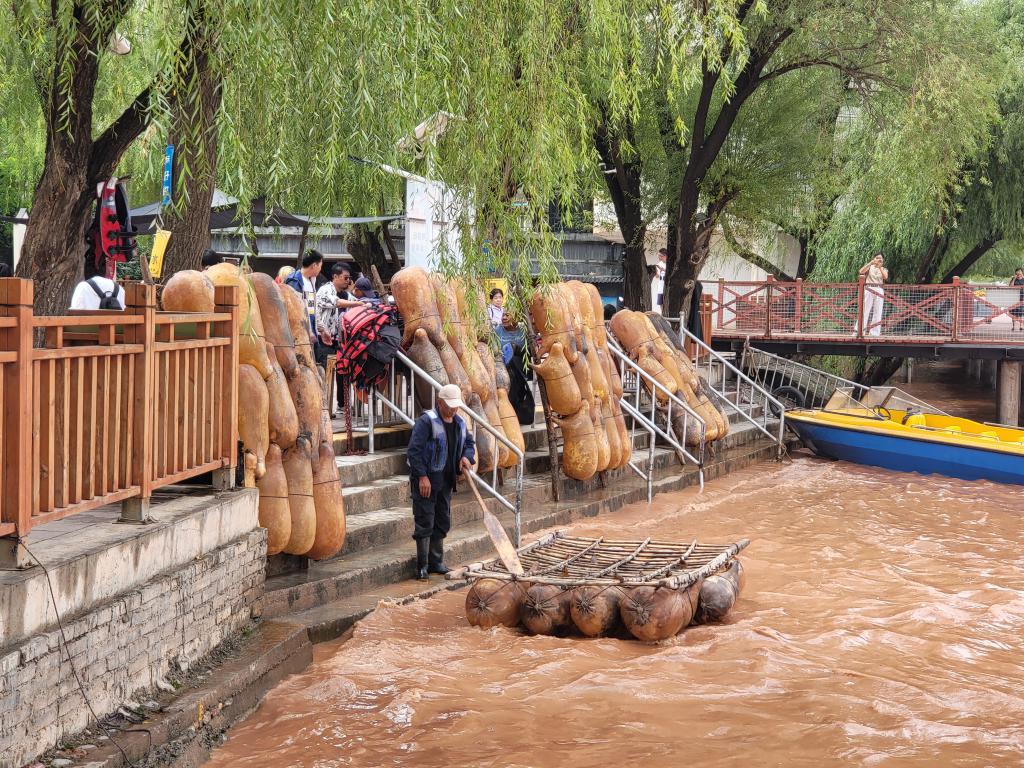 Inflated goat skin rafts taking tourists floating down Yellow 