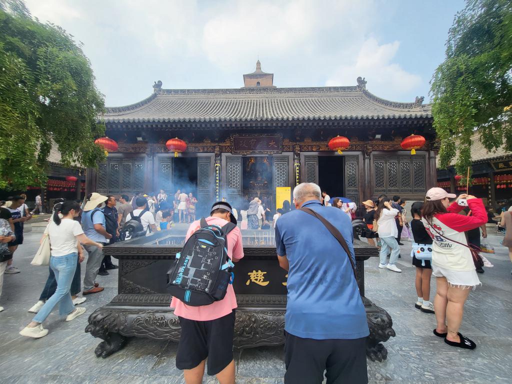 Praying and joss stick burning in the Great Wild Goose Temple