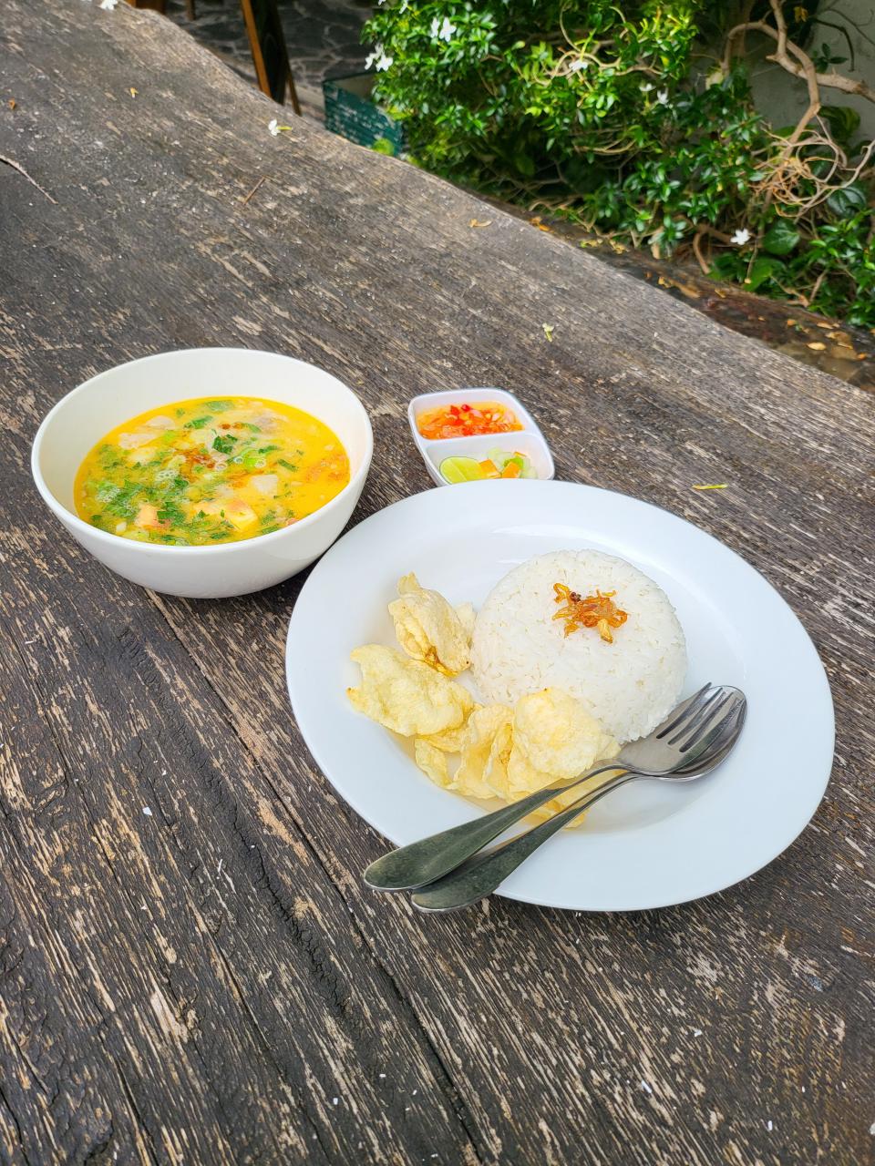 Breakfast of Indonesian Soto, of chicken and vegetable in coconut milk broth