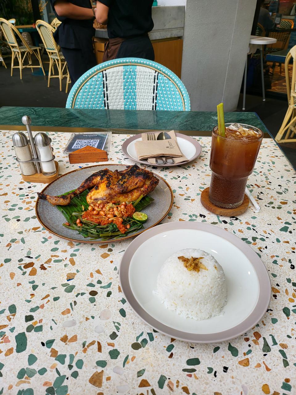 Lunch of grilled chicken and water spinach with spicy sambal