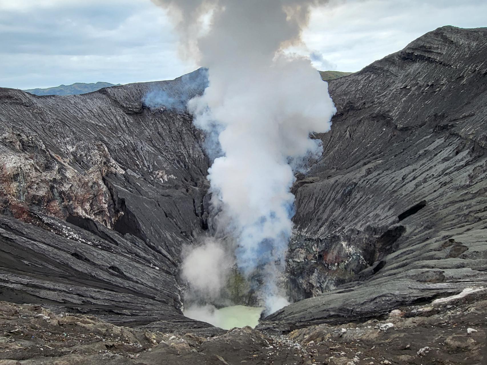 Mount Bromo billowing smoke from its crater