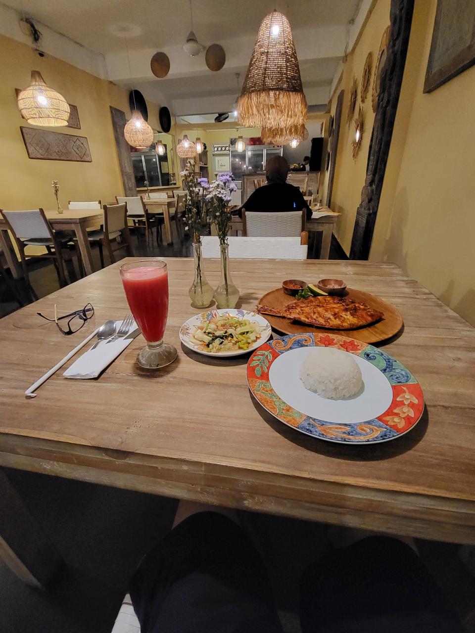 Dinner of grilled fish and stir-fried vegetable in Seminyak, Kuta