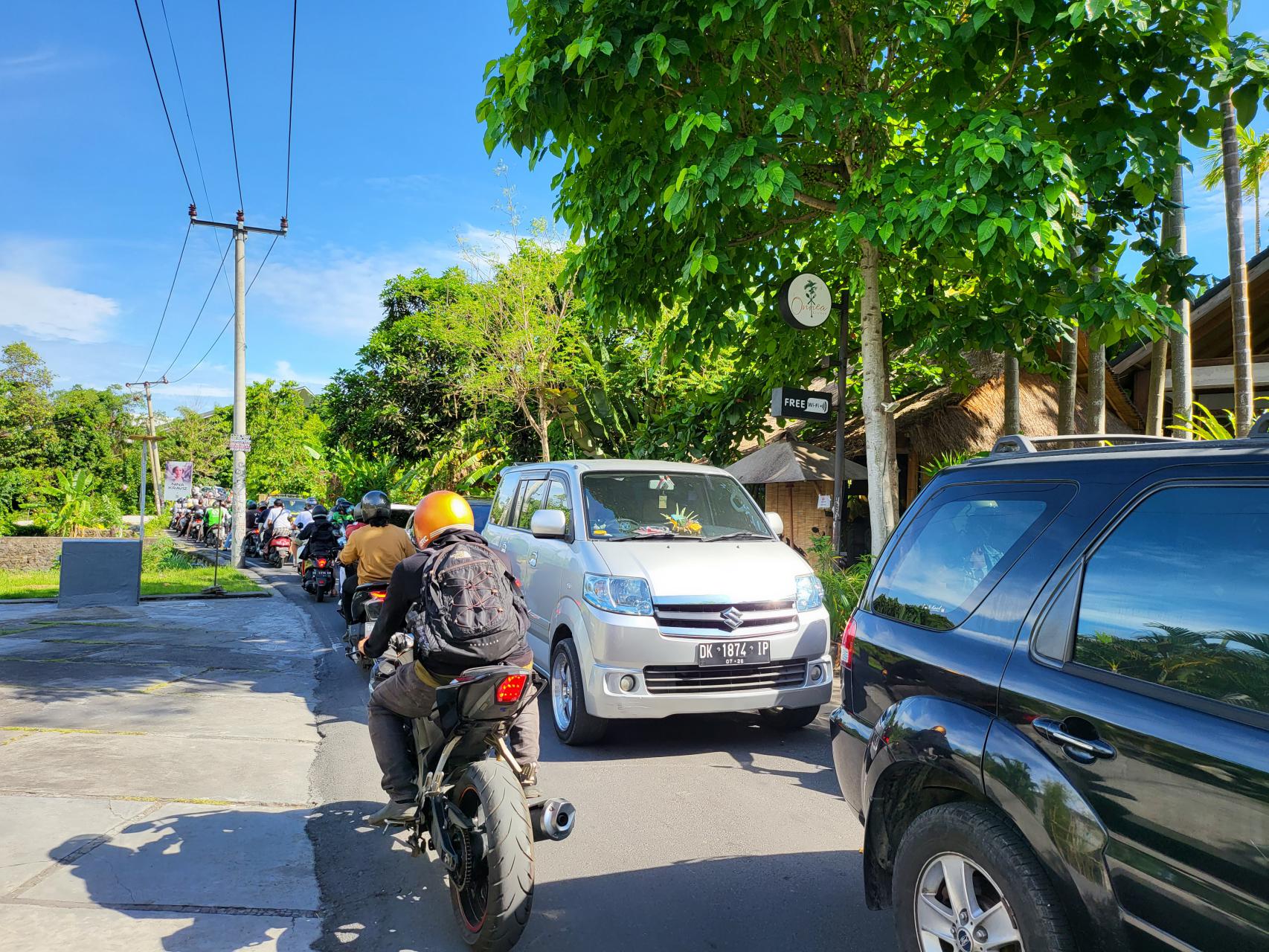 Riding bike on the narrow and busy streets to Canggu